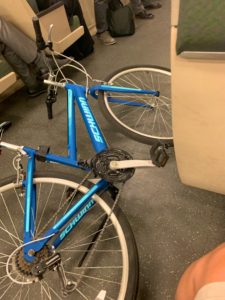 Schwinn bike lying down in BART train